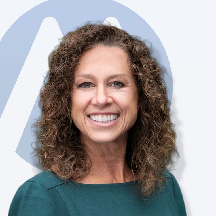 Professional headshot of Jacqui Friedrich with the Impact Health logo in the background.